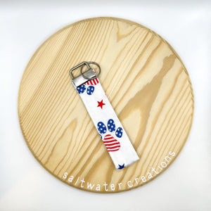 red white and paw print keychain